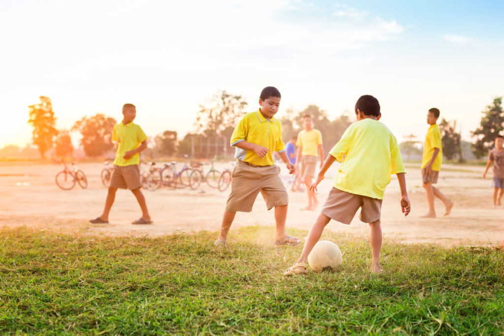 Youths Playing Football during social activities events